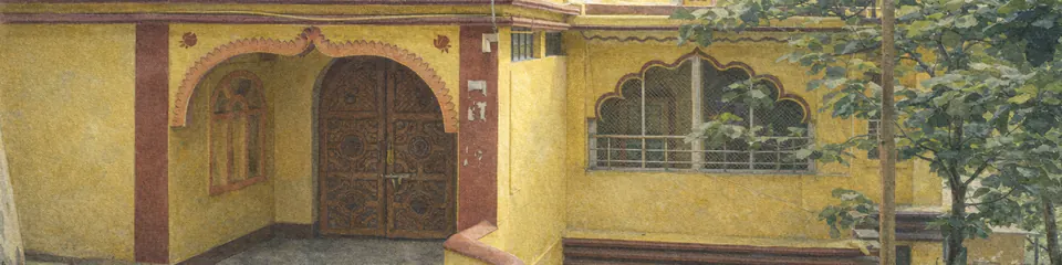 Painted facade detail of Bagalamukhi temple, showing its yellow walls, red trim and arched entrance.